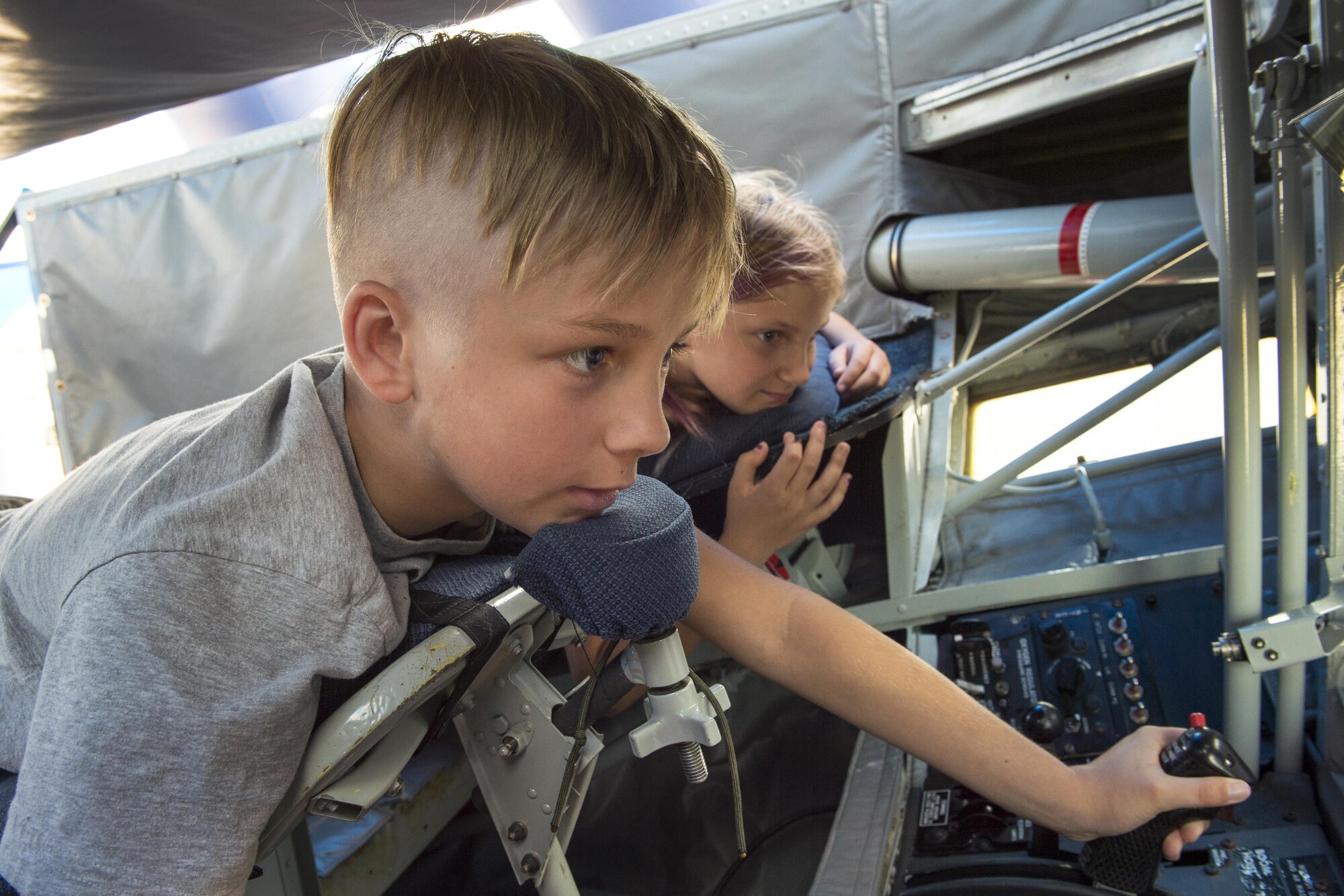 AJ Durosko, an airshow attendee from Pinkerington, Ohio, operates Grissom's KC-135R Stratotanker boom pod simulator at the Dayton Vectron Airshow in Dayton, Ohio, June 18, 2016. Grissom members routinely take the displays on the road to open houses, air shows and events to share information about Grissom and the Air Force Reserve Command with audiences who may not otherwise have an opportunity to visit. (U.S. Air Force photo/Tech. Sgt. Benjamin Mota)