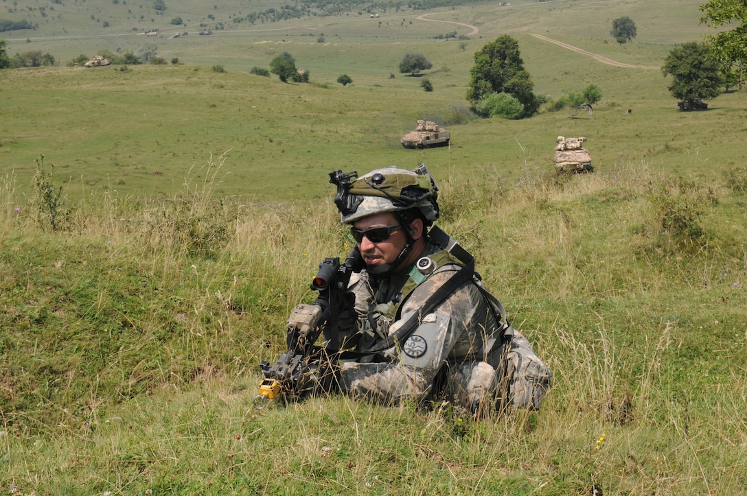 Army National Guard Spc. Colton Church takes a defensive position during Exercise Saber Guardian 16 at the Romanian Land Force Combat Training Center in Cincu, Romania, July 28, 2016.  Army photo by Staff Sgt. Corinna Baltos