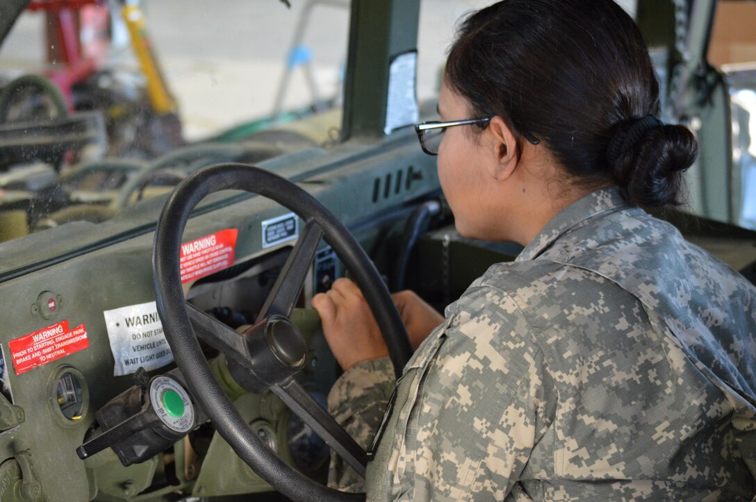 Army Reserve Spc. Kirsten S. Lee, 818th Support Maintenance Company, from Fort George G. Meade, MD., performs vehicle electrical maintenance during Platinum Wrench Annual Exercise at Ft. McCoy, Wis., on July 26, 2016. The hands-on exercise gives Soldiers training in maintenance procedures. (U.S. Army photo by Spc. Thomas Watters/Released)