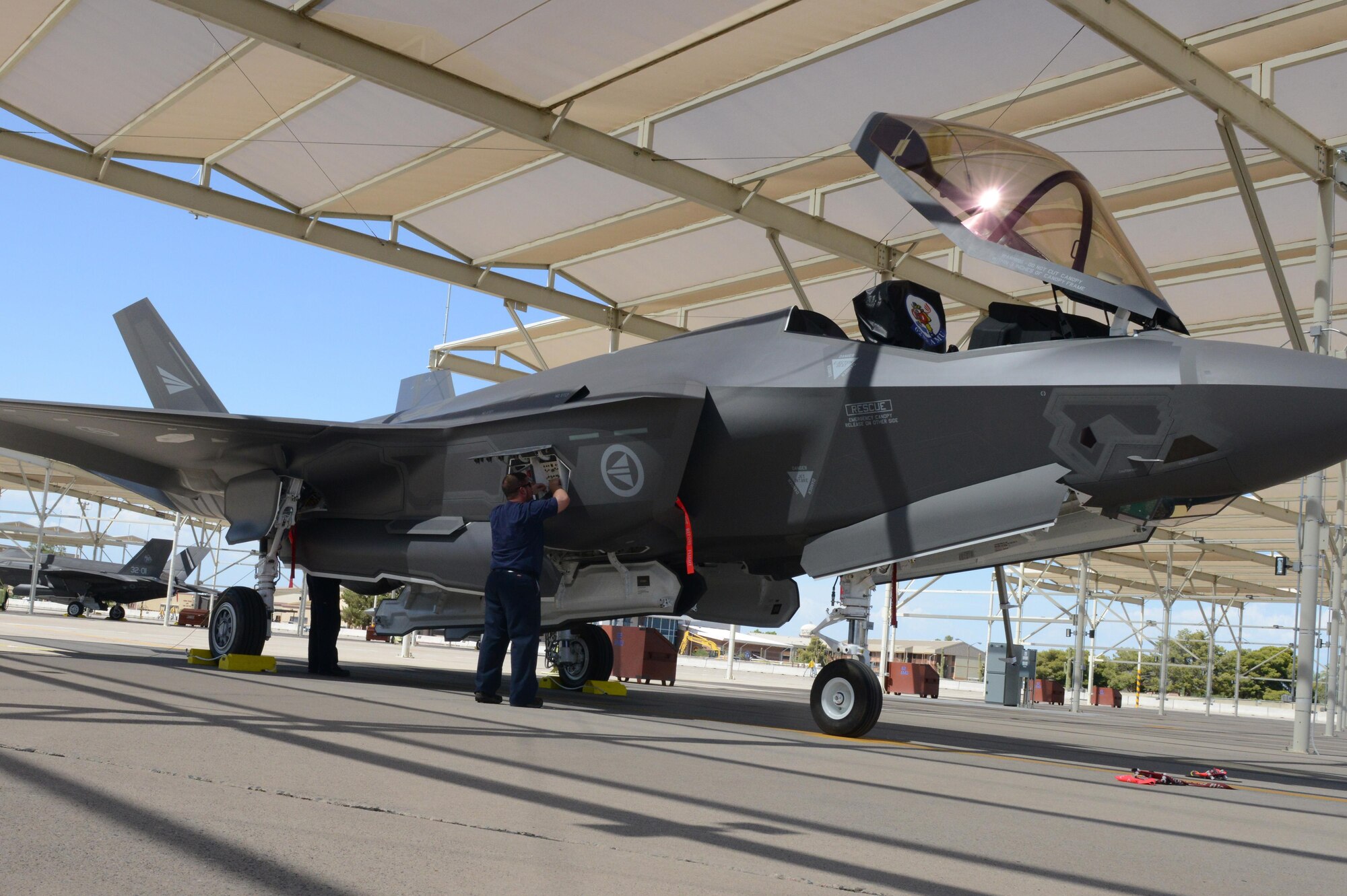 Eugene Sloskey, 62nd Fighter Squadron crew chief, works on the maintenance
interface panel of a Norwegian F-35A Lightning II at Luke Air Force Base,
Ariz., July 27, 2016. This is the fourth Norwegian F-35 to arrive at Luke.
(U.S. Air Force photo by Senior Airman James Hensley)
