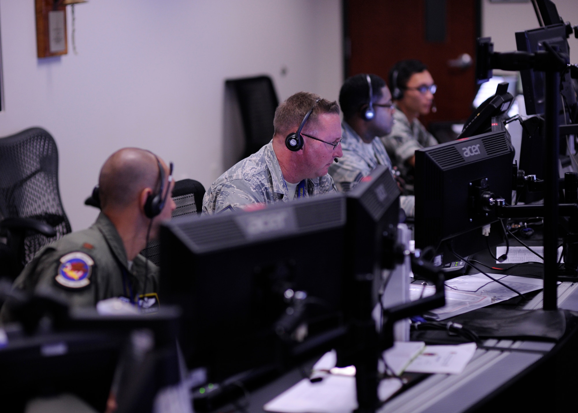 Members of the 81st Range Control Squadron conduct a command and control mission at the 81st RCS, Tyndall Air Force Base, Fla., July 26, 2016. The 81st RCS is the Air Force’s only ground control intercept control operation, supporting live air-to-air missile operational test and evaluation. (U.S. Air Force photo by Senior Airman Solomon Cook/Released)