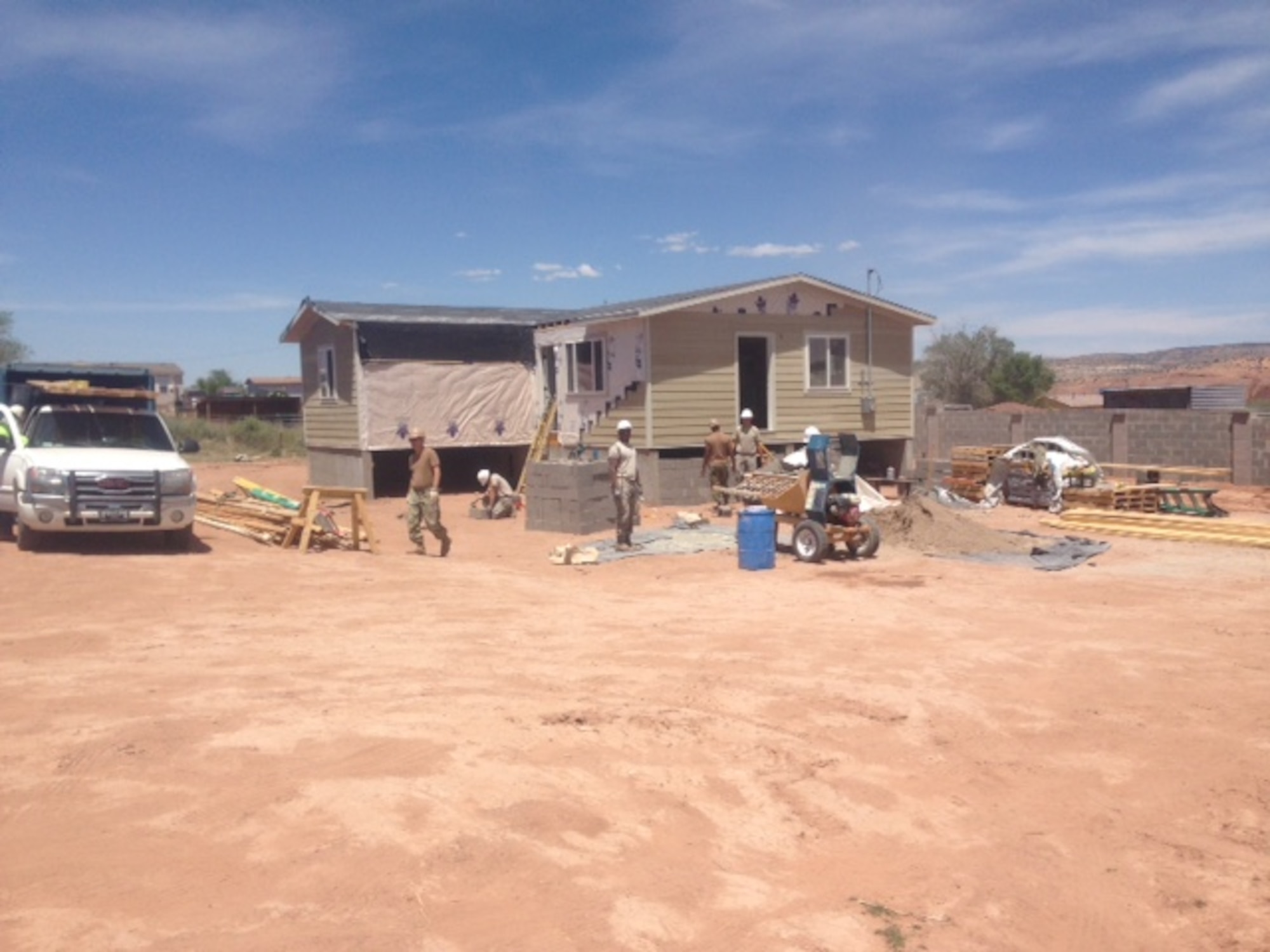 Through the Operation Footprint partnership, twenty-four Air Force Reservists from the 302nd Civil Engineer Squadron helped build new homes for the Navajo Nation during Innovative Readiness Training, May 22 to June 5, 2016 in Gallup, N.M. The 302nd CES contributed to completing the construction of five new homes during their two-week training. (Courtesy photo)