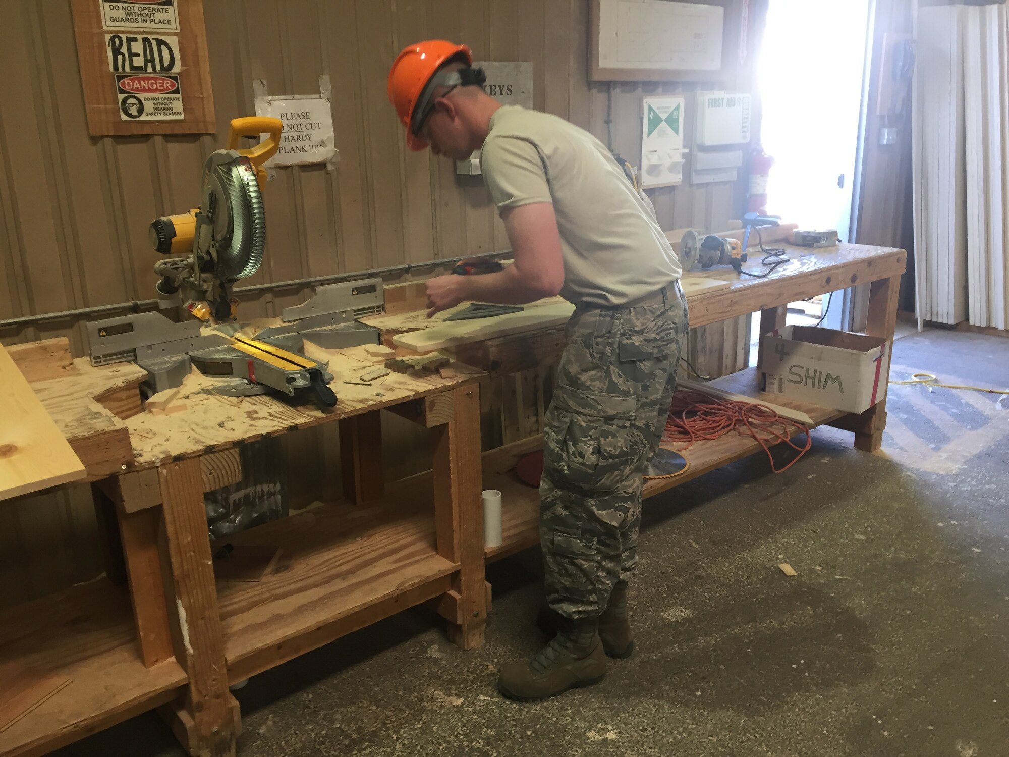 Senior Airman Conner Caron-Burton, 302nd Civil Engineer Squadron engineer apprentice, makes a windowsill for a modular home May 23, 2016 in Gallup, N.M. Eighty five percent of the modular homes are built in a warehouse and transported to the home site when finished. A team of twenty-four Air Force Reservists from the 302nd CES traveled to N.M. for Innovative Readiness Training to help build new homes for the Navajo nation and develop tradesman skills. (Courtesy photo)