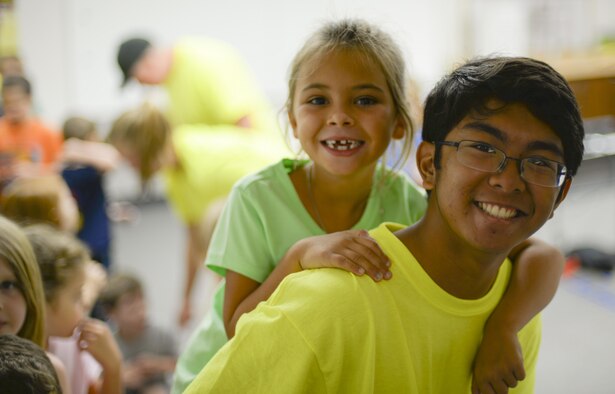 Joseph, a volunteer at the base chapel’s vacation bible school, gives Lorelai, a child attending the VBS program, a piggyback ride to her next activity station at Holloman Air Force Base, N.M., on July 20. Many of Holloman Chapel’s VBS volunteers regularly attend the chapel’s religious services. (Last names are being withheld due to operational requirements. U.S. Air Force photo by Amn Alexis P. Docherty/released) 