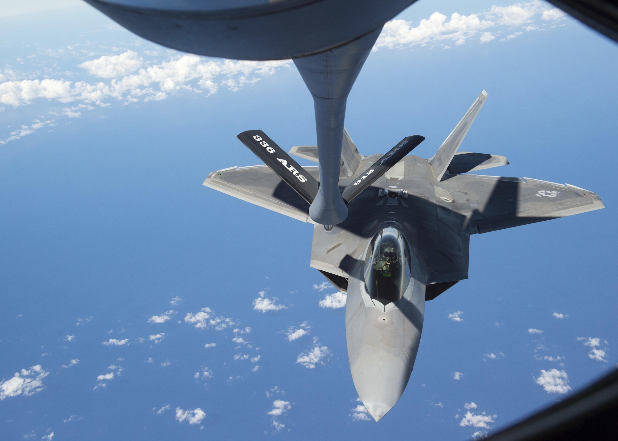 An F-22 Raptor from the 199th Fighter Squadron prepares for air refueling from a KC-135R Stratotanker operated by 465th Air Refueling Squadron from Tinker Air Force Base, Oklahoma, during Rim of the Pacific 2016 over Joint Base Pearl Harbor-Hickam, Hawaii, July 26, 2016. (U.S. Navy photo by Mass Communication Specialist 2nd Class Gregory A. Harden II)