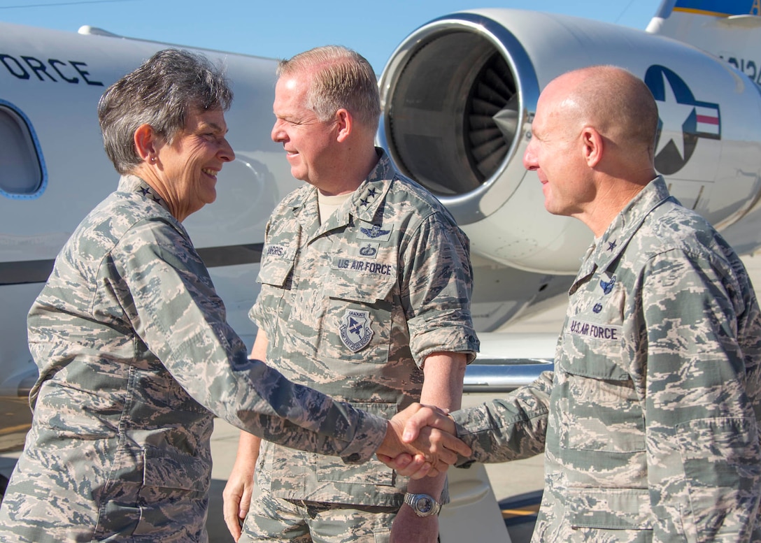 Gen. Ellen M. Pawlikowski (from left), Air Force Materiel Command commander, is greeted by Maj. Gen. David Harris, Air Force Test Center commander, and Brig. Gen. Carl Schaefer, 412th Test Wing commander, as she steps off the plane July 20. (U.S. Air Force photo by Christopher Okula)
