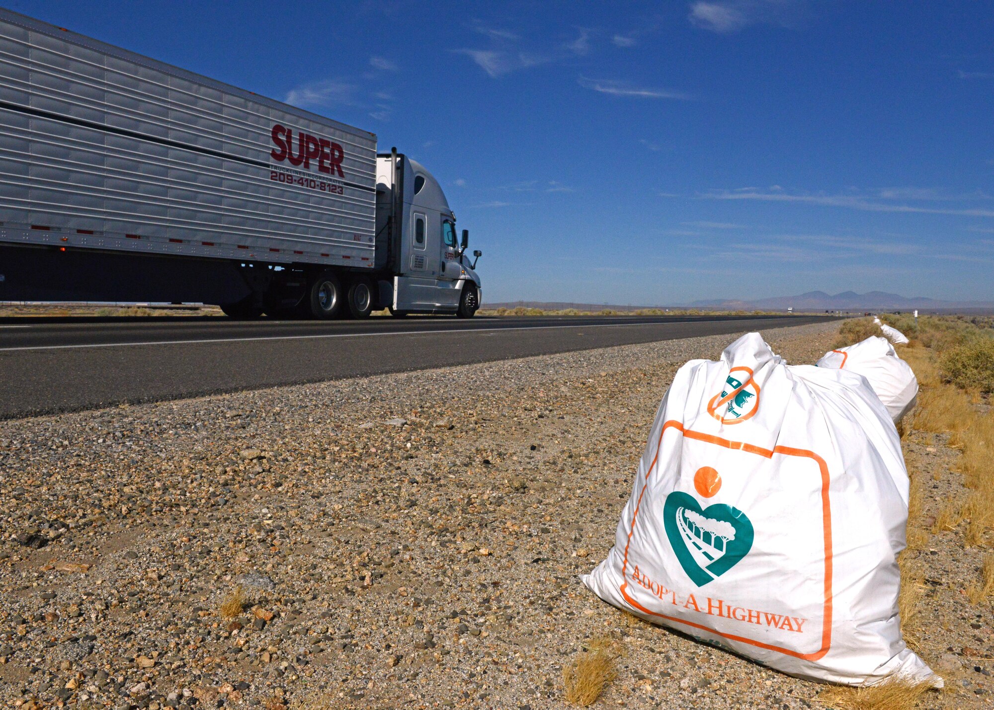 Air Force Research Laboratory Airmen took to Highway 58 to pick up trash July 22 as part of Caltrans' Adopt-A-Highway program. (U.S. Air Force photo by Kenji Thuloweit)