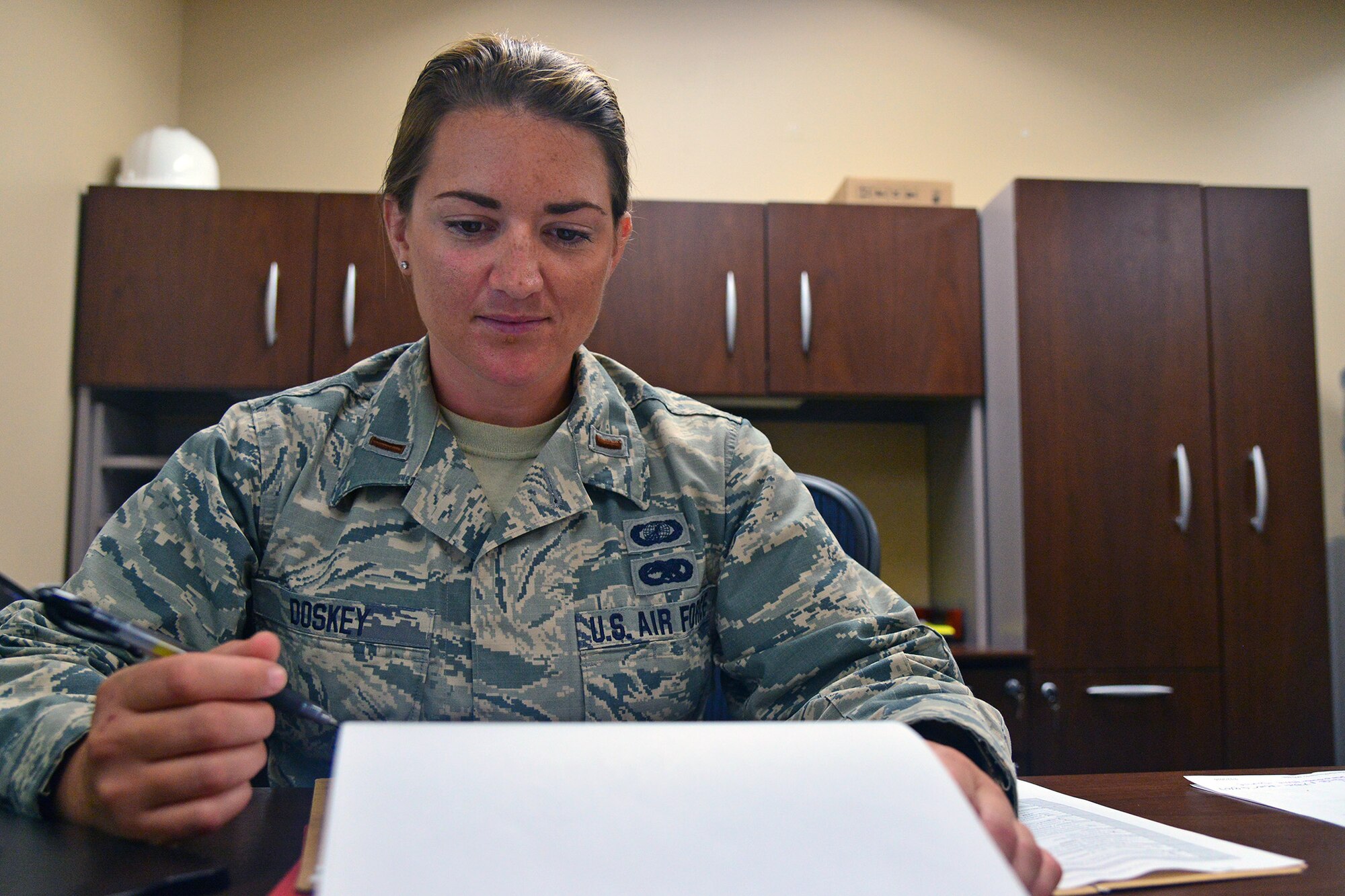 2nd Lt. Teresa Doskey, 341st Contracting Squadron commodities flight commander, reviews paperwork July 27, 2016, at Malmstrom Air Force Base, Mont. The contracting squadron works hard to ensure Malmstrom has what it needs to execute the daily nuclear deterrent mission. (U.S. Air Force photo/Airman 1st Class Daniel Brosam)