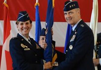 Gen. Lori Robinson, commander of North American Aerospace Defense Command and United States Northern Command, passes the guidon to Lt. Gen. Scott Williams, the incoming commander of Continental U.S. NORAD Region-1st Air Force (Air Forces Northern), at the CONR-1st AF change of command ceremony at Tyndall AFB, Fla., July 6, 2016. First Air Force has the responsibility of ensuring the air sovereignty and air defense of the continental United States.