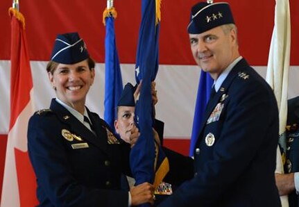 Gen. Lori Robinson, commander of North American Aerospace Defense Command and United States Northern Command, passes the guidon to Lt. Gen. Scott Williams, the incoming commander of Continental U.S. NORAD Region-1st Air Force (Air Forces Northern), at the CONR-1st AF change of command ceremony at Tyndall AFB, Fla., July 6, 2016. First Air Force has the responsibility of ensuring the air sovereignty and air defense of the continental United States.
