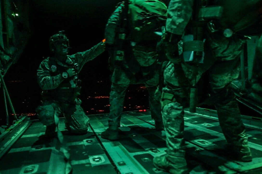 Reconnaissance Marines with Maritime Raid Force, 11th Marine Expeditionary Unit, prepare to aerially insert from a C-130 Hercules aircraft onto a specified objective area located in Southern Calif., June 13, 2016, as part of a reconnaissance and surveillance mission. The mission was conducted during the MEU’s Realistic Urban Training exercise, which is held in preparation for the MEU’s upcoming Western Pacific 16-2 deployment to the Pacific and Central Commands’ areas of operation. (U.S. Marine Corps photo by Lance Cpl. Devan K. Gowans)