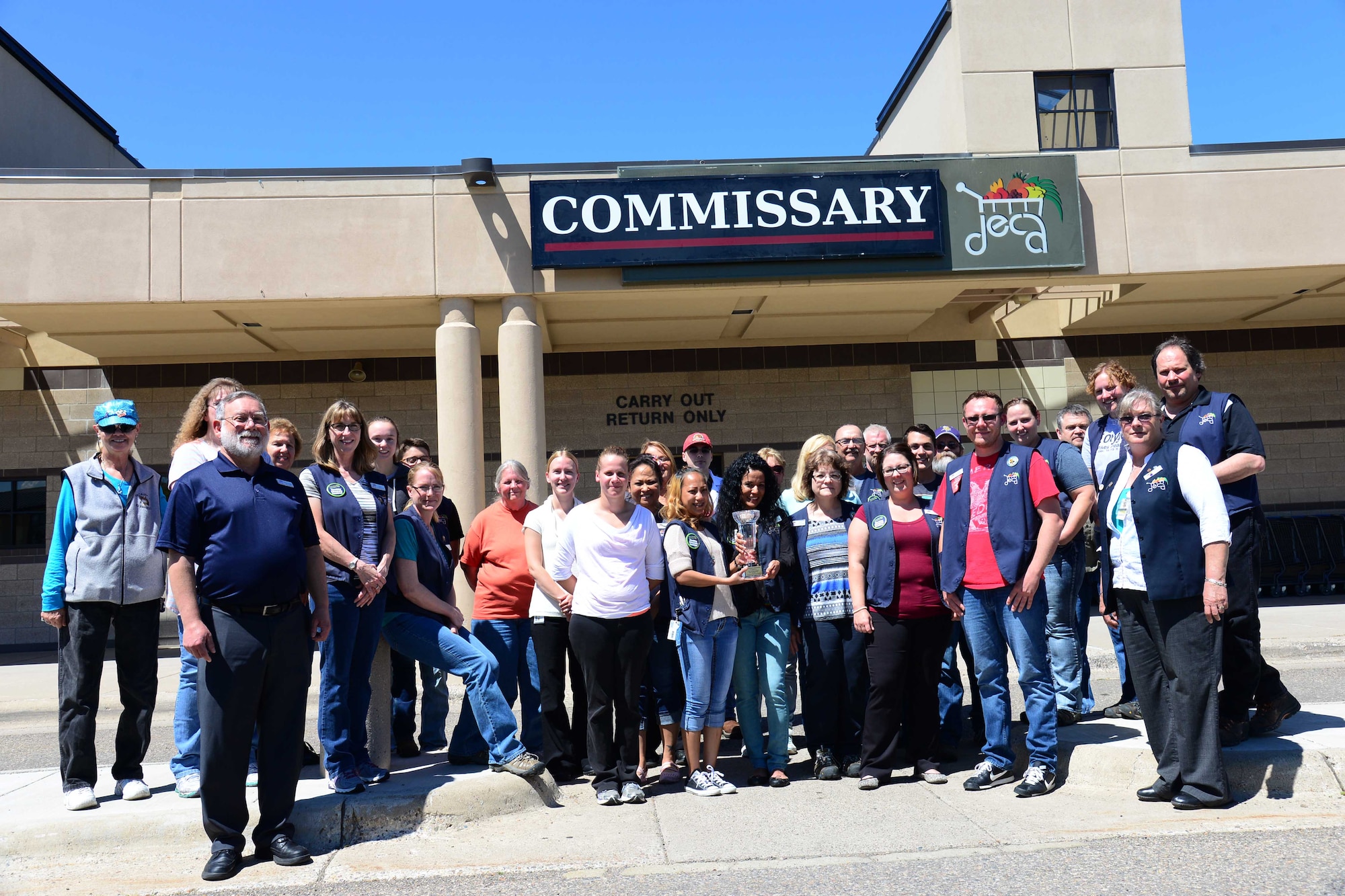 The Malmstrom Commissary team poses for a photo July 28, 2016, at Malmstrom Air Force Base, Mont. The Defense Commissary Agency awarded the Malmstrom Commissary the Bill Nichols Award for Best Large Commissary in the United States. (U.S. Air Force photo/Airman 1st Class Magen M. Reeves)