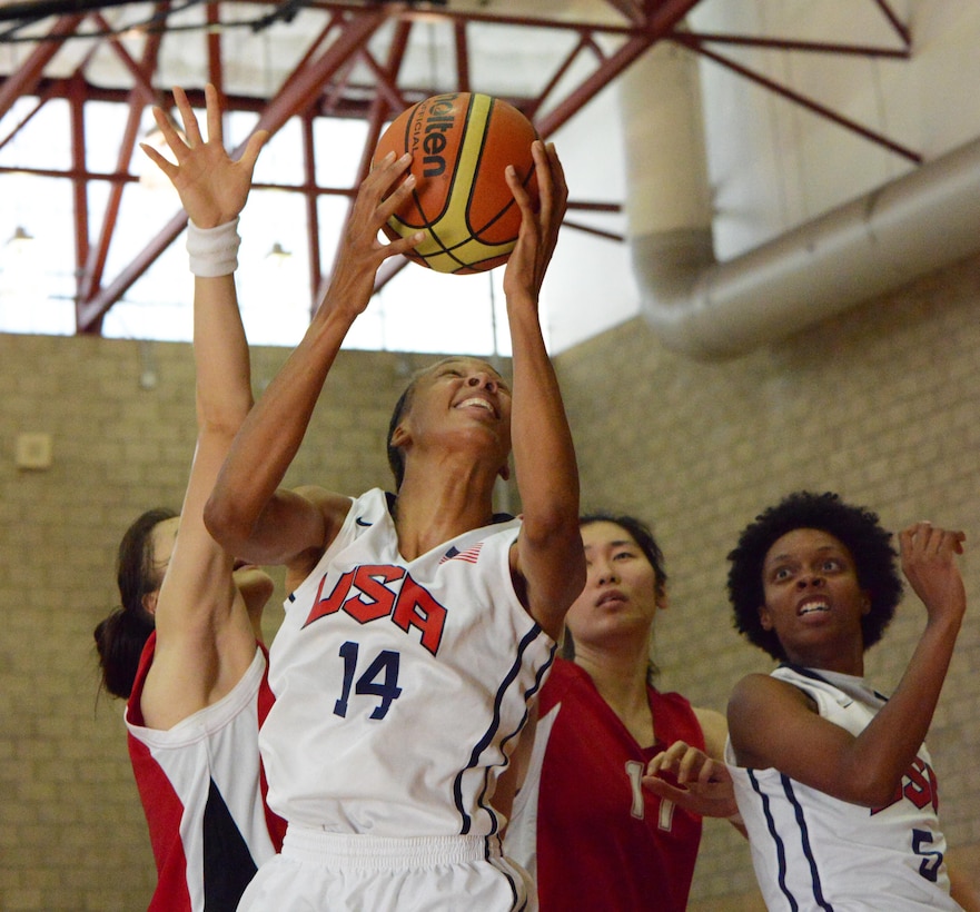 USA's Danielle Salley dominates the offensive board against two defenders from China as USA wins 73-56, in the CISM Women's Basketball Championship, July 27, 2016, at Camp Pendleton, Calif.