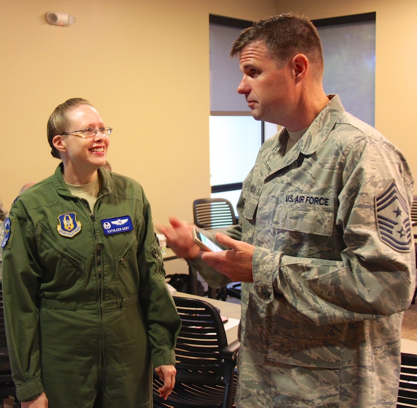 Commander of the 932nd Aeromedical Evacuation Squadron, Lt. Col. Kathleen Kent, talks with 932nd Airlift Wing Command Chief Master Sgt. Chad Welch, the top enlisted leader, about the challenges and strategic plan for 2017 during a recent commander's off site session.  She and the other squadron and group commanders discussed priorities for the rest of 2016 and 2017, which include executing the mission, leading people, managing resources, and improving the unit as they gear up for inspections and possible future deployments.  (U.S. Air Force photo by Maj. Stan Paregien)