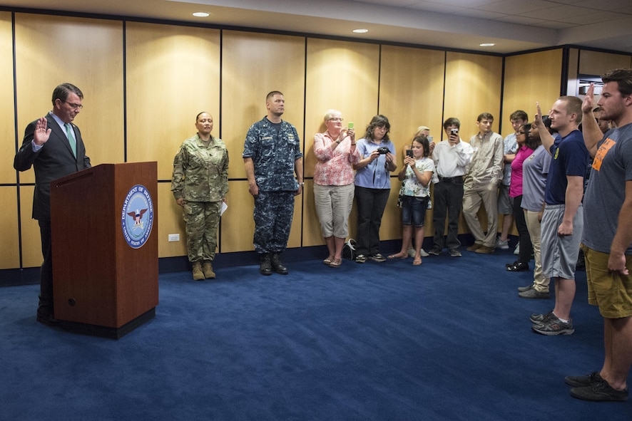 Defense Secretary Ash Carter performs an oath of enlistment ceremony.