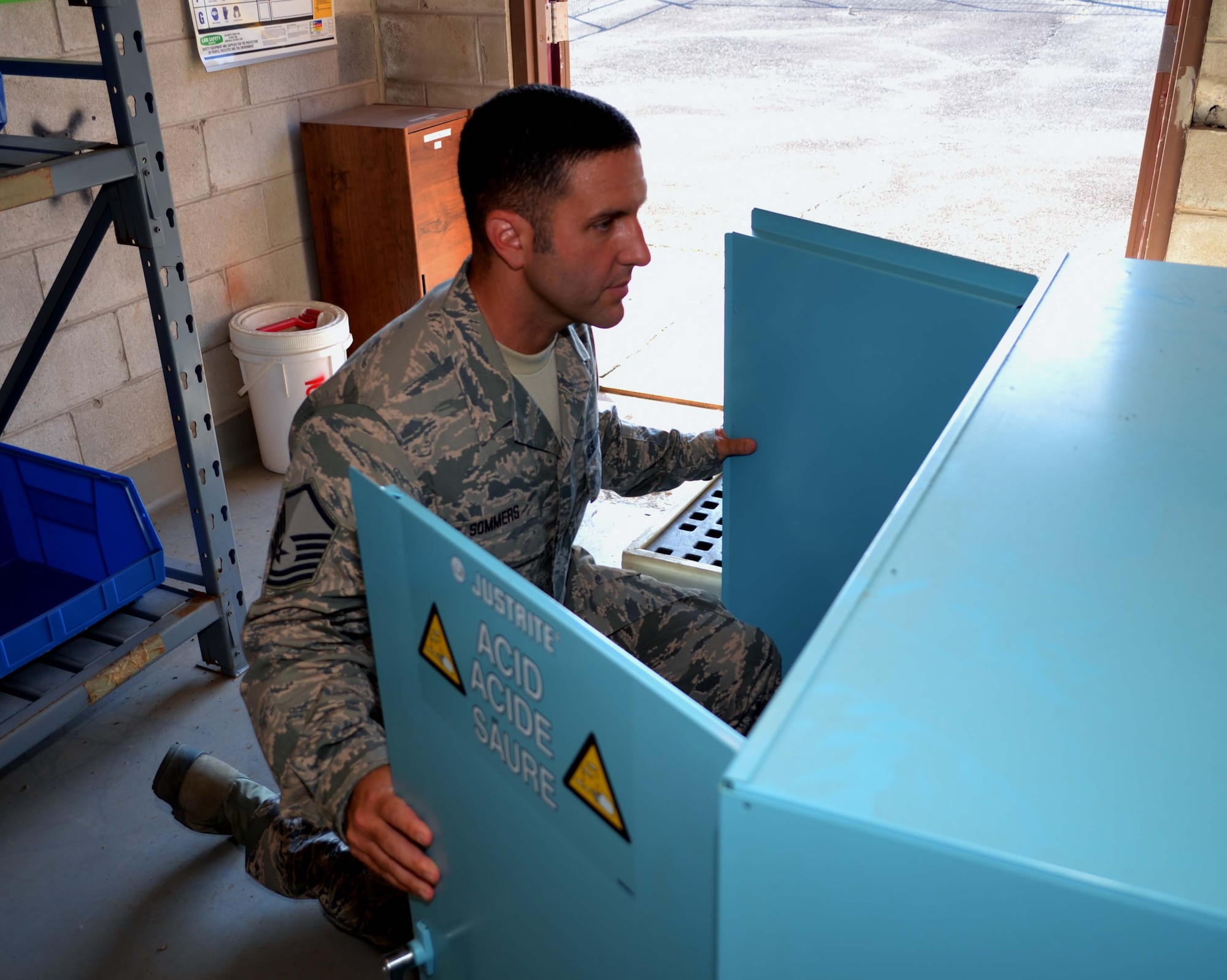 Master Sgt. Joe Sommers, from the 111th Logistics Readiness Squadron with a primary duty of manning the Hazardous Material (HazMat) Pharmacy opens a cabinet in the HazMat Pharmacy at Horsham Air Guard Station, Pa., July 8, 2016. The 111th LRS has managed to maintain an empty HazMat Pharmacy, which has led to a significant decrease in the installation's creation of hazardous waste. (U.S. Air National Guard photo by Tech. Sgt. Andria Allmond)