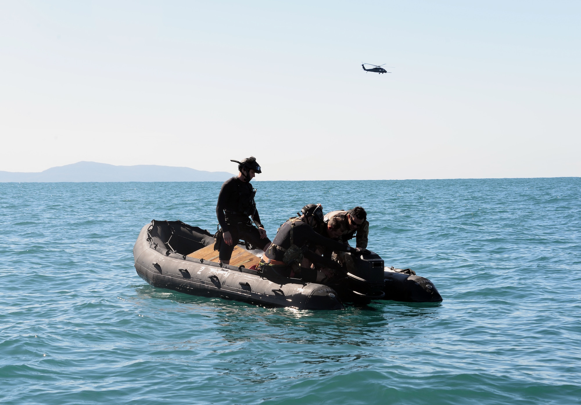 Pararescuemen with the 129th Rescue Wing perform the startup engine process on-board a Zodiac during an exercise for operation Angel Reign in Townsville Aus. June 29, 2016.  (U.S. Air National Guard photo by Senior Airman Zachiah Roberson/released)