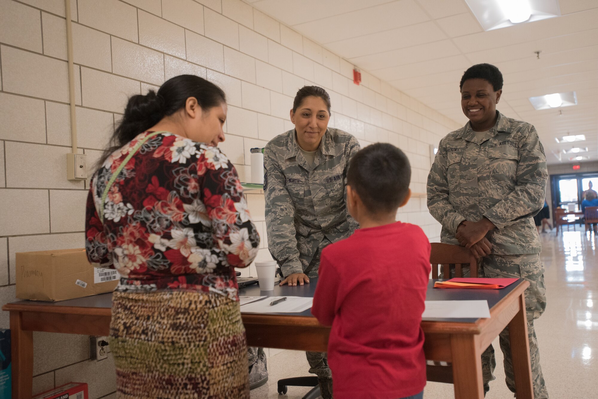 Master Sgt. Nikki Nazworth (left), patient administration non-commissioned officer-in-charge for the 123rd Medical Group Detachment 1, Kentucky Air National Guard, and Tech. Sgt. Gloria Wilson, unit deployment manager for the 123rd Medical Group, help patients check-out after receiving medical care at Graves County High School in Mayfield, Ky., July 20, 2016, during Bluegrass Medical Innovative Readiness Training. The Kentucky Air National Guard, U.S. Navy Reserve and other military units are teaming with the Delta Regional Authority to offer medical and dental care at no cost to residents in Mayfield and two other Western Kentucky locations from July 18 to 27 as part of the training event. (U.S. Air National Guard photo by Master Sgt. Phil Speck)
