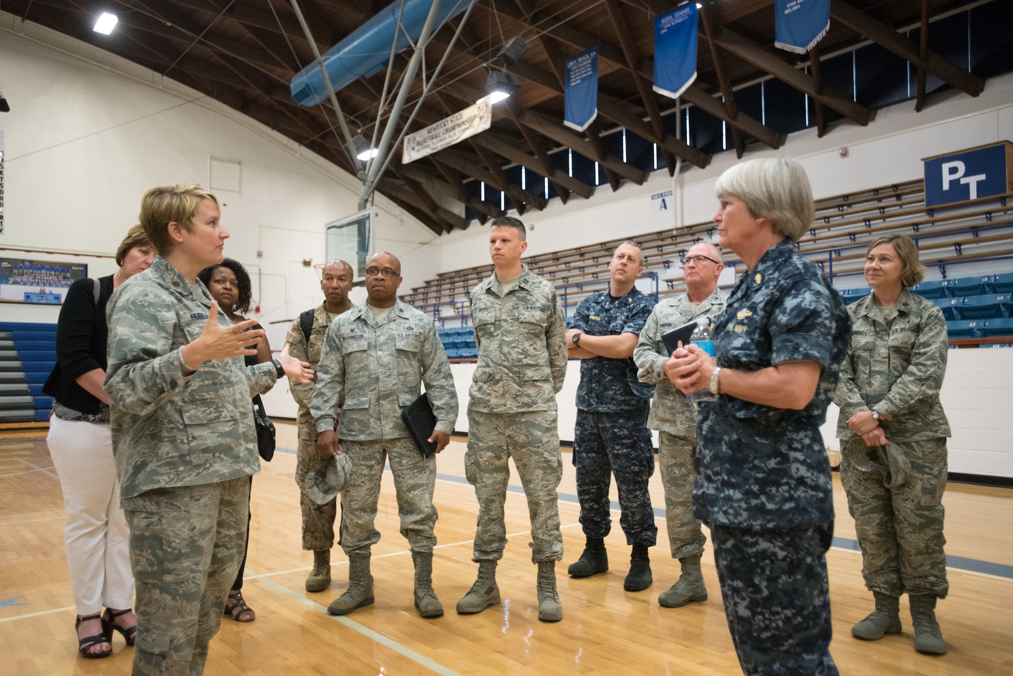 Maj. Tiffany Hubbard, a nurse from the Kentucky Air National Guard’s 123rd Medical Group, speaks to U.S. Navy Rear Adm. Priscilla Coe, deputy chief of staff for the U.S. Navy Bureau of Medicine and Surgery and deputy chief of the Navy Reserve Dental Corps, and a group of distinguished visitors during a tour of a health care clinic at Paducah Tilghman High School in Paducah, Ky., July 23, 2016. The clinic is one of three being operated in Western Kentucky by members of the Air National Guard and U.S. Navy Reserve to provide no-cost medical, dental and optical care to area residents from July 17 to 28. Hubbard is site manager of the Paducah clinic. (U.S. Air National Guard photo by Master Sgt. Phil Speck)