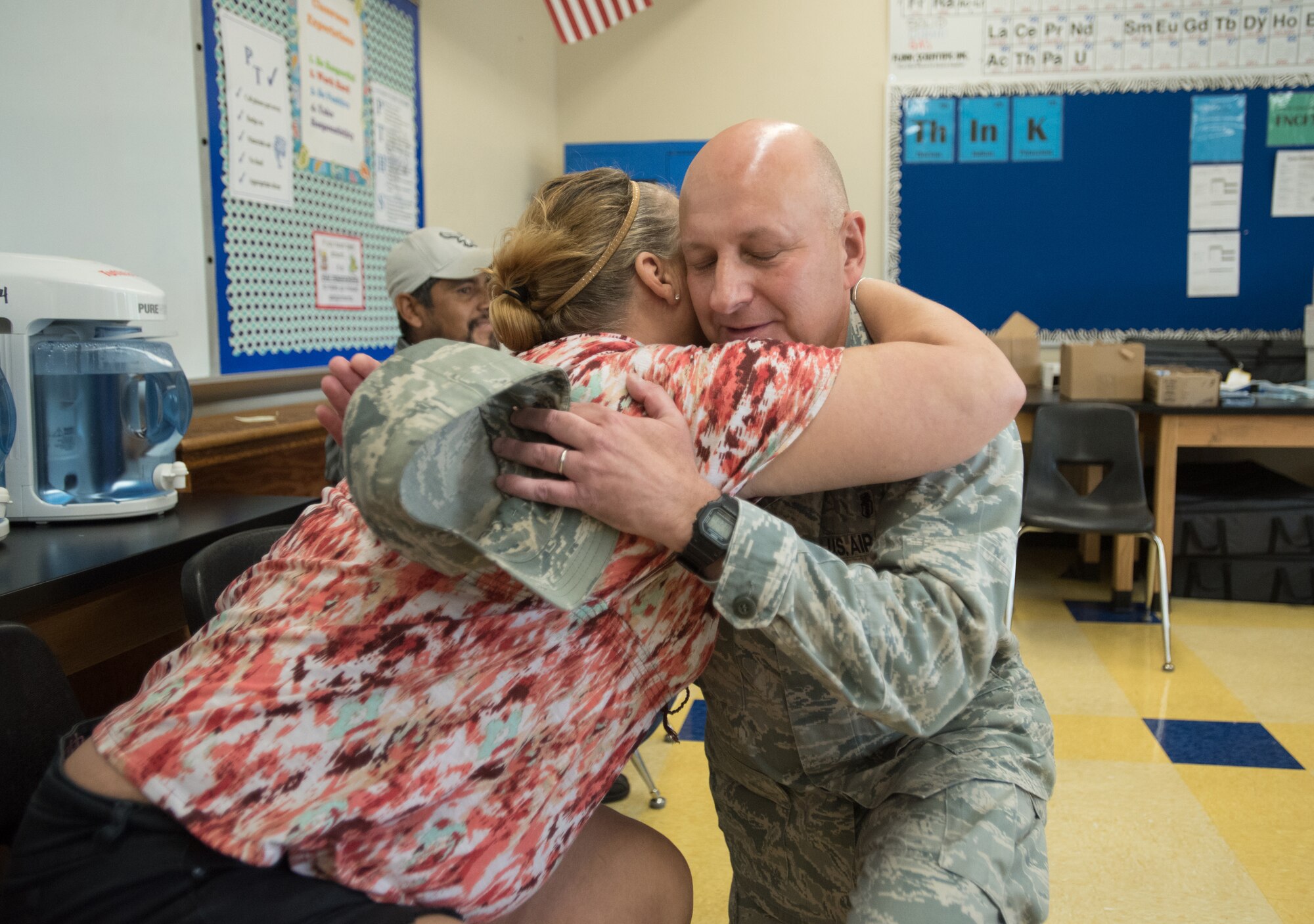 Col. Michael Cooper, commander of the Kentucky Air National Guard’s 123rd Medical Group, receives a hug from a Western Kentucky resident as thanks for the no-cost medical care she received at a military clinic at Paducah Tilghman High School in Paducah, Ky., July 23, 2016. The clinic and two others in Western Kentucky have provided thousands of medical, dental and optical services to area residents since standing up July 18 as part of a program called Bluegrass Medical Innovative Readiness Training. The program is a partnership between the U.S. Department of Defense and the Delta Regional Authority, with care provided by members of the U.S. Navy Reserve and the Air National Guard. (U.S. Air National Guard photo by Master Sgt. Phil Speck)