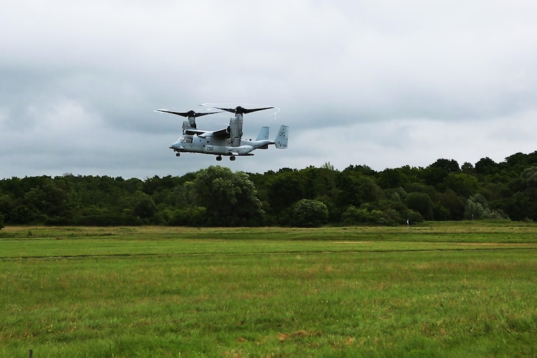 An MV-22B Osprey with Marine Medium Tiltrotar Squadron 263, Special Purpose Marine Air-Ground Task Force-Crisis Response-Africa prepares to touchdown in a field to pick up an assault force during a combined arms attack aboard Camp Sissonne, France, June 21, 2016. During CENZUB training, SPMAGTF-CR-AF Marines had the opportunity to work in cooperation with a company of French Army soldiers, integrating their skills and resources including weaponry and military vehicles to form an effective battle plan, similar to what they may face in the event of a future crisis. (U.S. Marine Corps photo by Sgt. Kassie McDole/Released.)