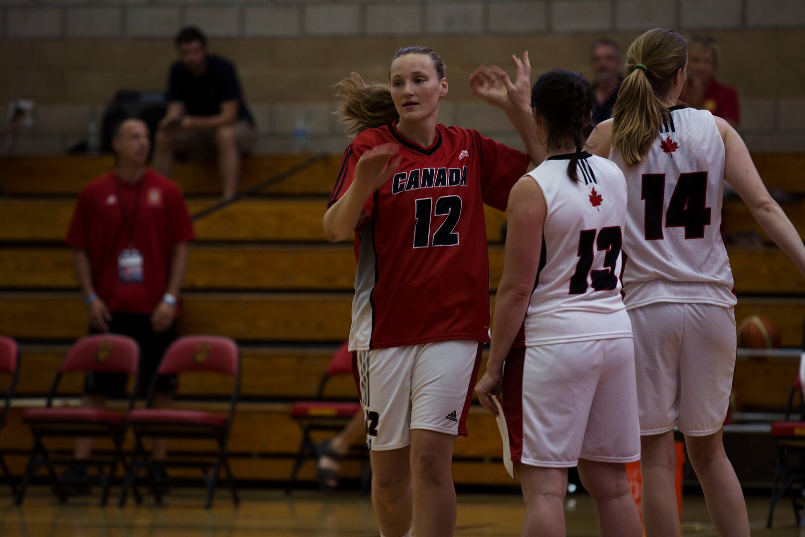 Canadian Army Lt. Sandy Edmison of the Canadian Military Women’s Basketball Team walks onto the court prior to the Canada vs. Brazil game at the Conseil International Du Sport Militaire (CISM) World Military Women’s Basketball Championship July 27 at Camp Pendleton, California. The base is hosting the CISM World Military Women’s Basketball Championship July 25 through July 29 to promote peace activities and solidarity among military athletes through sports. (U.S. Marine Corps photo by Sgt. Abbey Perria)