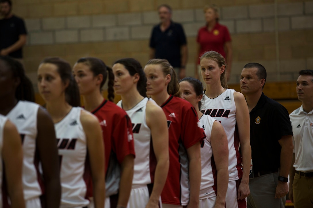 The Canadian Military Women’s Basketball Team stands for the playing of Canada’s and Brazil’s national anthems before the Canada vs. Brazil game at the Conseil International Du Sport Militaire (CISM) World Military Women’s Basketball Championship July 27 at Camp Pendleton, California. The base is hosting the CISM World Military Women’s Basketball Championship July 25 through July 29 to promote peace activities and solidarity among military athletes through sports. (U.S. Marine Corps photo by Sgt. Abbey Perria)