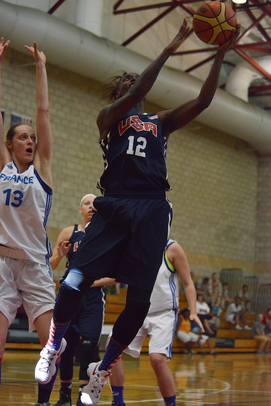 U.S. Army Sgt. Kimberly Smith drives past a French defender to lay it up as USA beat France 85-53 during day two of the CISM Women's Basketball Championship at Camp Pendleton, Calif., July 26, 2016.