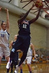 U.S. Army Sgt. Kimberly Smith drives past a French defender to lay it up as USA beat France 85-53 during day two of the CISM Women's Basketball Championship at Camp Pendleton, Calif., July 26, 2016.