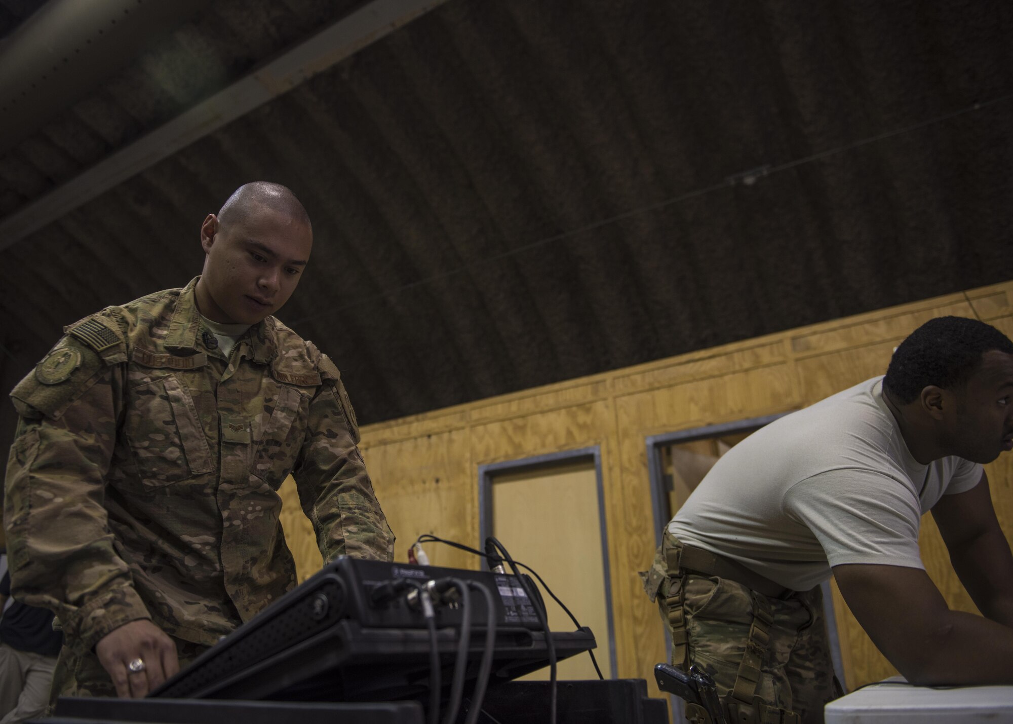 Senior Airman Ryan Custodio, 455th Expeditionary Communications Squadron, radio frequency transmission system technician, sets up a public announcement system, Bagram Airfield, Afghanistan, July 27, 2016. The RF transmissions section provides public address system support for official functions such as change of command ceremonies and distinguish visitors. They also maintain the base Land Mobile Radio (LMR) network. (U.S. Air Force photo by Senior Airman Justyn M. Freeman)