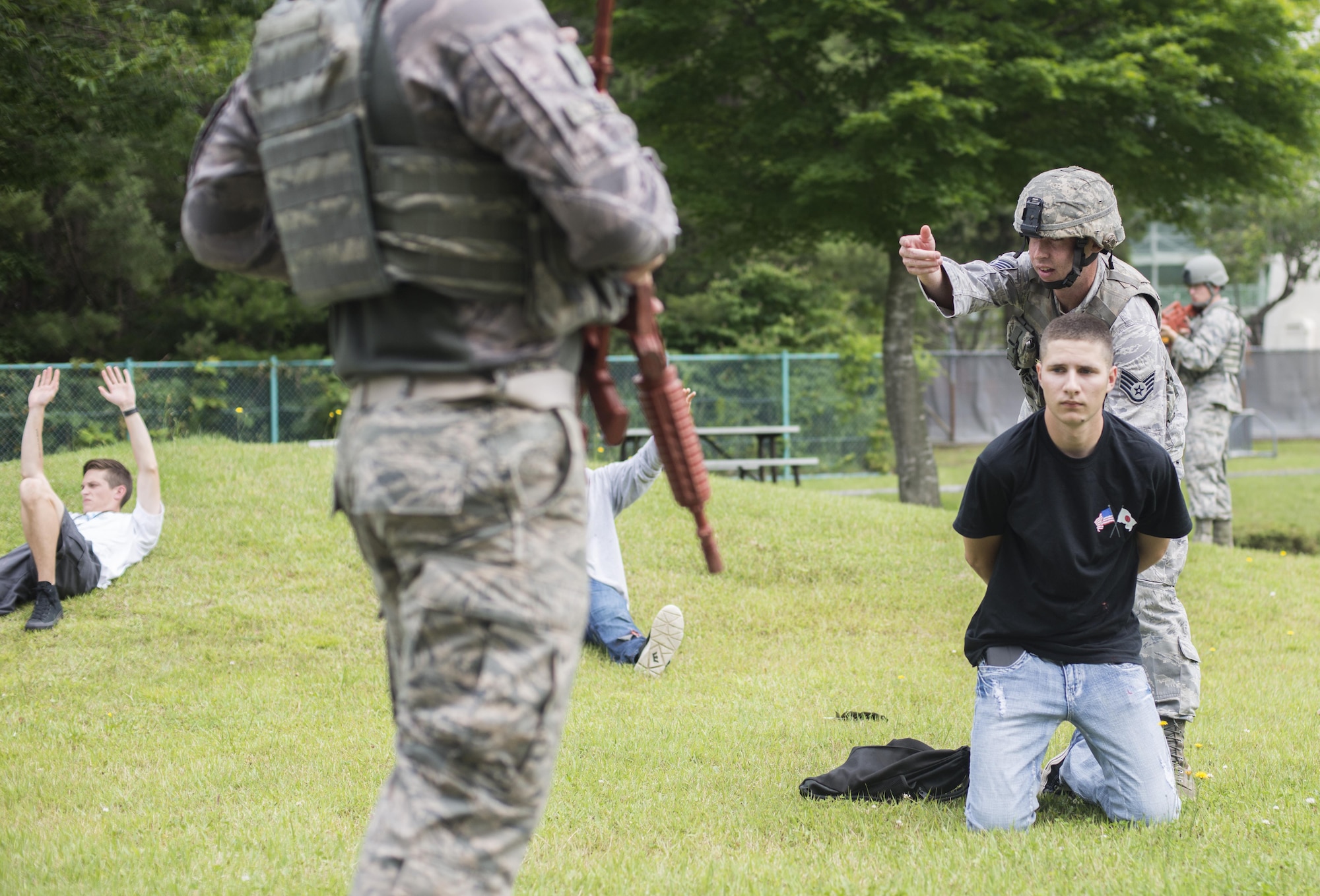U.S. Air Force Reserve Staff Sgt. Mitchell Melot, a fire team member with the 507th Security Forces Squadron, apprehends a suspect during the Beverly Sunrise 16-05 active shooter exercise held July 29, 2016, at Misawa Air Base, Japan. The 35th Fighter Wing performs these training exercises bi-annually in order to ensure all Misawa personnel know how to properly respond in such a situation. (U.S. Air Force photo by Senior Airman Brittany A. Chase)