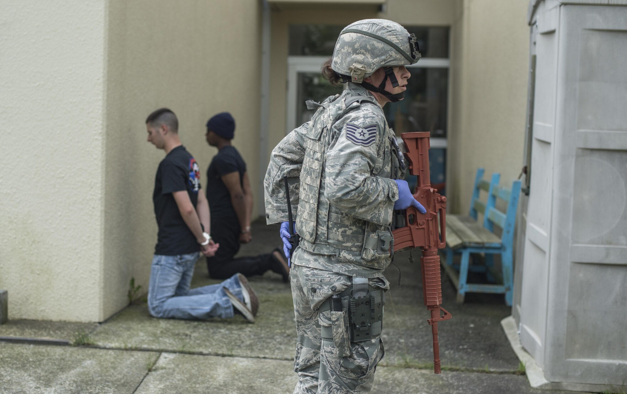 U.S. Air Force Reserve Tech. Sgt. Heather Bennett, a police one patrolman with the 507th Security Forces Squadron, guards suspects during the Beverly Sunrise 16-05 active shooter exercise held July 29, 2016, at Misawa Air Base, Japan. The 35th Fighter Wing performs these training exercises bi-annually in order to ensure all Misawa personnel know how to properly respond in such a situation. (U.S. Air Force photo by Senior Airman Brittany A. Chase)