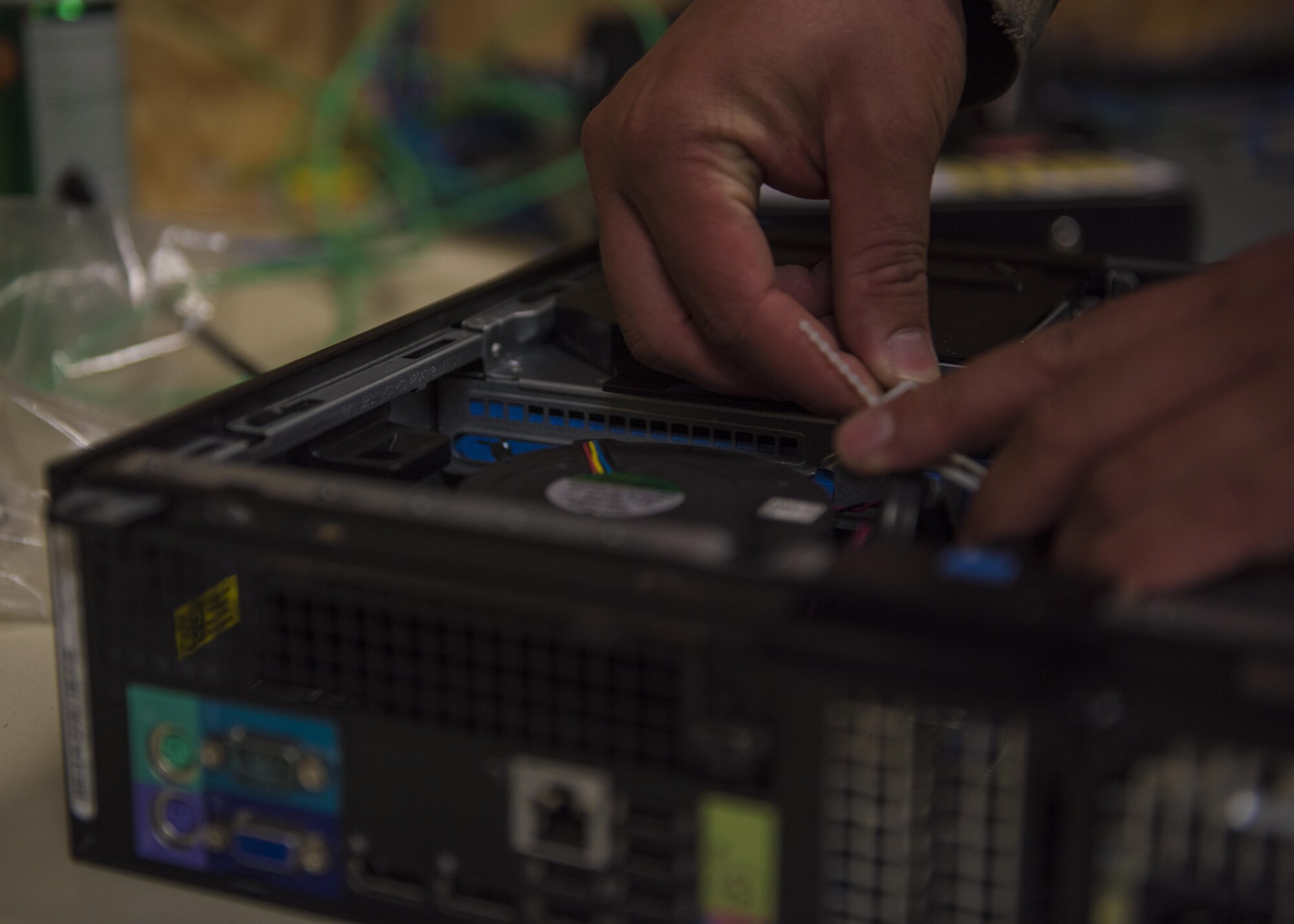 Staff Sgt. Joseph Commisso-Vinetti, 455th Expeditionary Communications Squadron, client system technician, troubleshoots computer hardware, Bagram Airfield, Afghanistan, July 27, 2016. The CST shop provides on-site repairs for system malfunctions that are not able to be repaired remotely. (U.S. Air Force photo by Senior Airman Justyn M. Freeman)