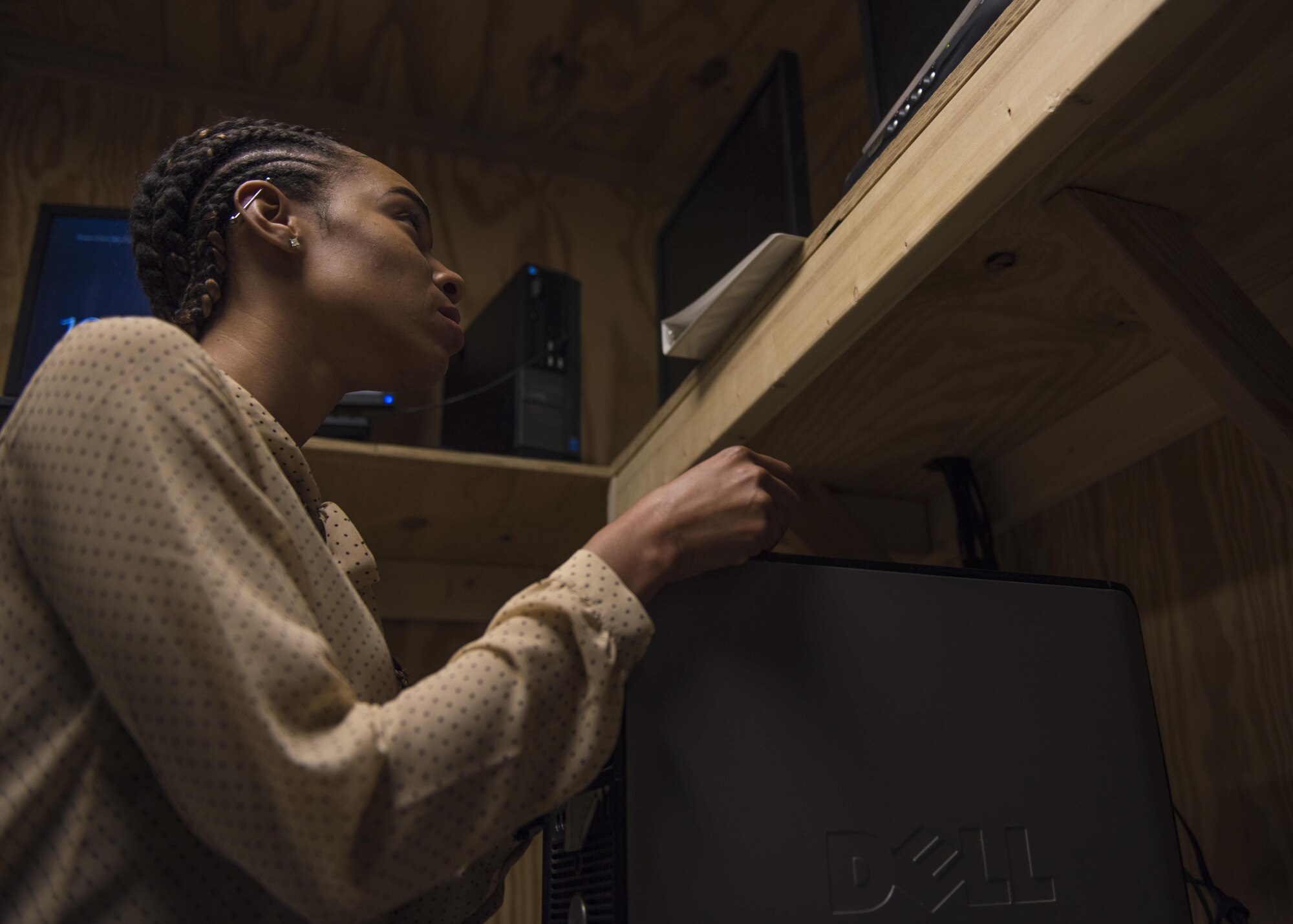 Tiona Walker, 455th Expeditionary Communications Squadron, client system administrator, performs a hardware diagnostics, Bagram Airfield, Afghanistan, July 27, 2016. Client system technicians run diagnostics to help assess and repair hardware malfunctions. (U.S. Air Force photo by Senior Airman Justyn M. Freeman)