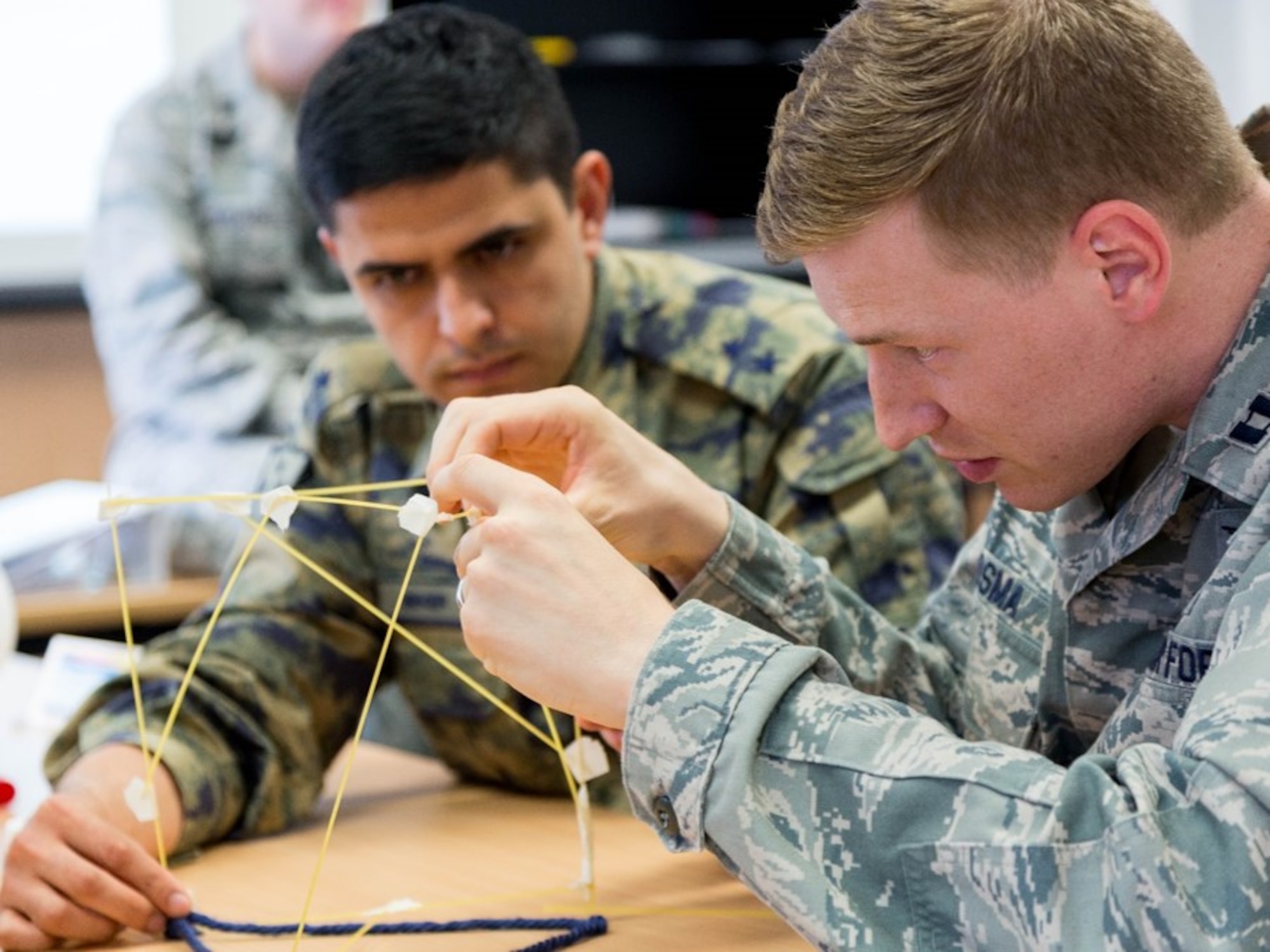 U.S. Air Force Capt. Alexander Roosma, 1st Combat Communications Squadron transmissions systems flight commander, participates in a strategic thinking exercise during the Inter-European Air Force Academy’s second combined Squadron Officer School and NCO Academy in-residence course June 20 to July 22, 2016, at Kapaun Air Station, Germany. From June 20 to July 22, 2016, 43 officer and NCO students from 13 European nations and the U.S. participated in the courses. (U.S. Air Force photo/Senior Master Sgt. Travis Robbins)