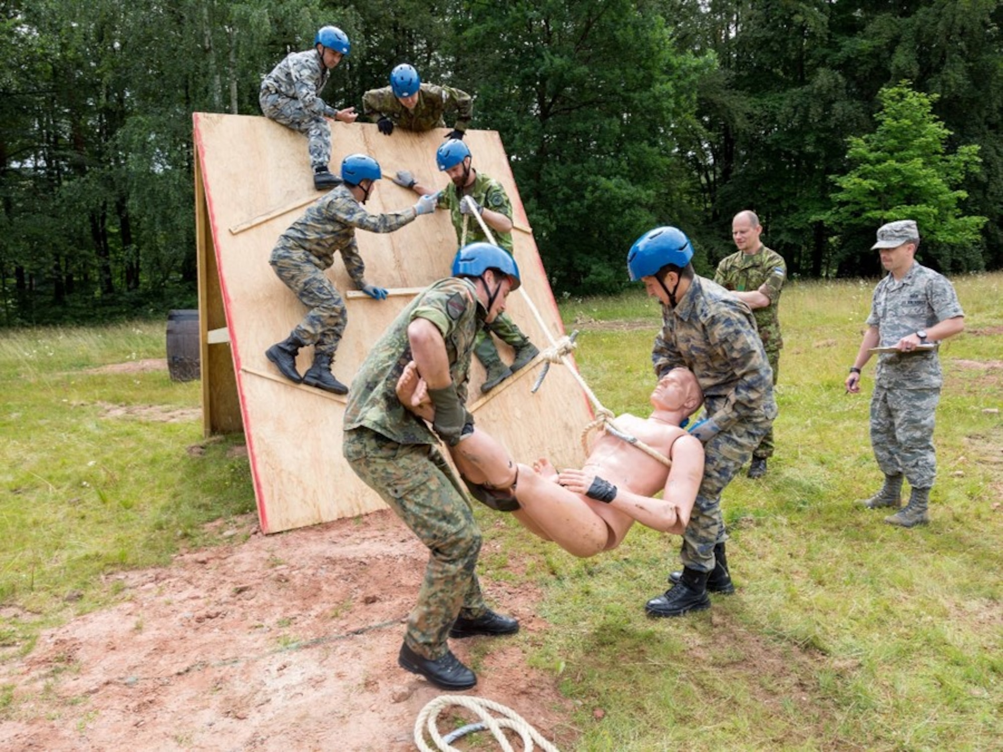 International officers and NCOs participate in a leadership reaction course during the Inter-European Air Force Academy’s second combined Squadron Officer School and NCO Academy in-residence course June 20 to July 22, 2016, at Kapaun Air Station, Germany. From June 20 to July 22, 2016, 43 officer and NCO students from 13 European nations and the U.S. participated in the courses. (U.S. Air Force photo/Senior Master Sgt. Travis Robbins)