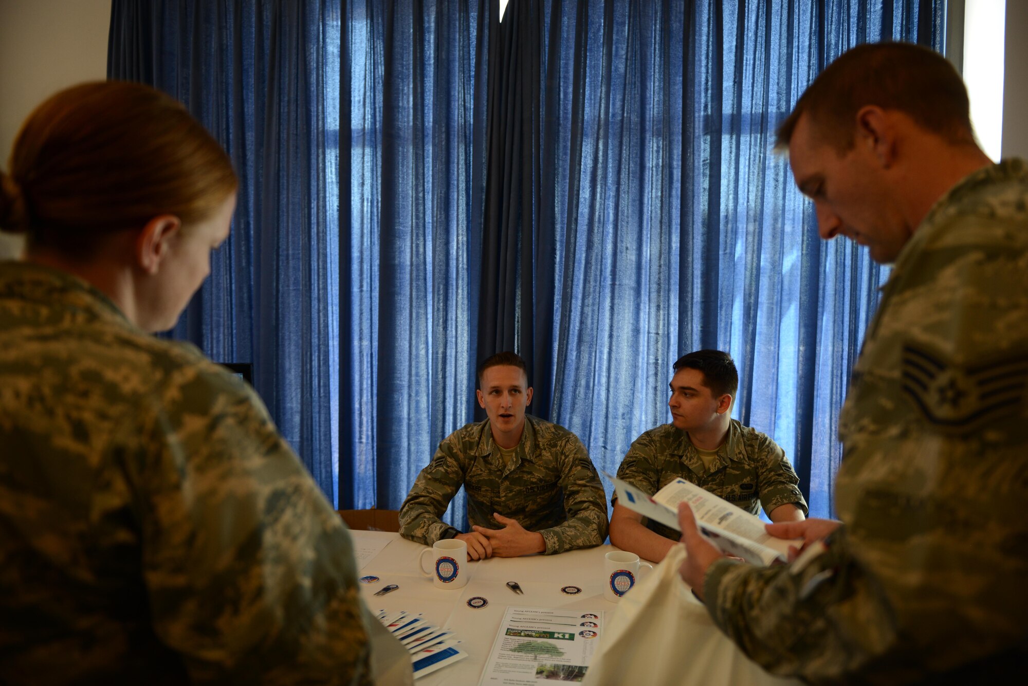 Senior Airman Blake Wicker, 86th Communication Squadron radio frequencies transmission systems technician, shares about the Armed Forces Communications and Electronics Association at Ramstein Air Base, Germany, July 19, 2016. AFCEA chapter 158 hosted the Ramstein Technology Exposition which took place at the Ramstein Officer’s Club. (U.S. Air Force photo/ Airman 1st Class Joshua Magbanua)