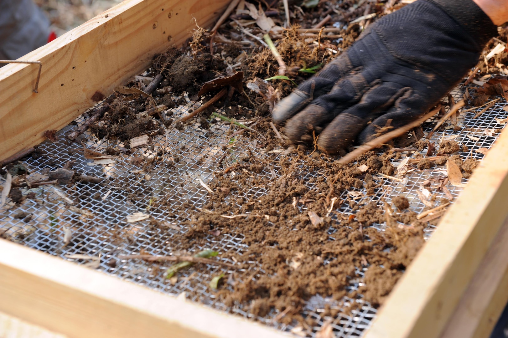 U.S. Air Force Senior Master Sgt. John Dizonno, an individual augmentee for the Defense POW/MIA Accounting Agency (DPAA), screens excavated dirt from a test pit in the Xiangkhoang Province, Lao People’s Democratic Republic, March 10, 2016. Members of DPAA deployed to the area in hopes of recovering the remains of a pilot unaccounted for during the Vietnam War. DPAA’s mission is to provide the fullest possible accounting for our missing personnel to their families and the nation. 