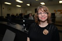 Rebecca Bryant, a Faculty Development instructor and native of Tulsa, Oklahoma, stands in-front of her training development class at Sheppard Air Force Base, Texas, July 28, 2016. Bryant recently achieved more than 10,000 instructional hours teaching Faculty Development courses at Sheppard. (U.S. Air Force photo by Senior Airman Kyle E. Gese/Released)