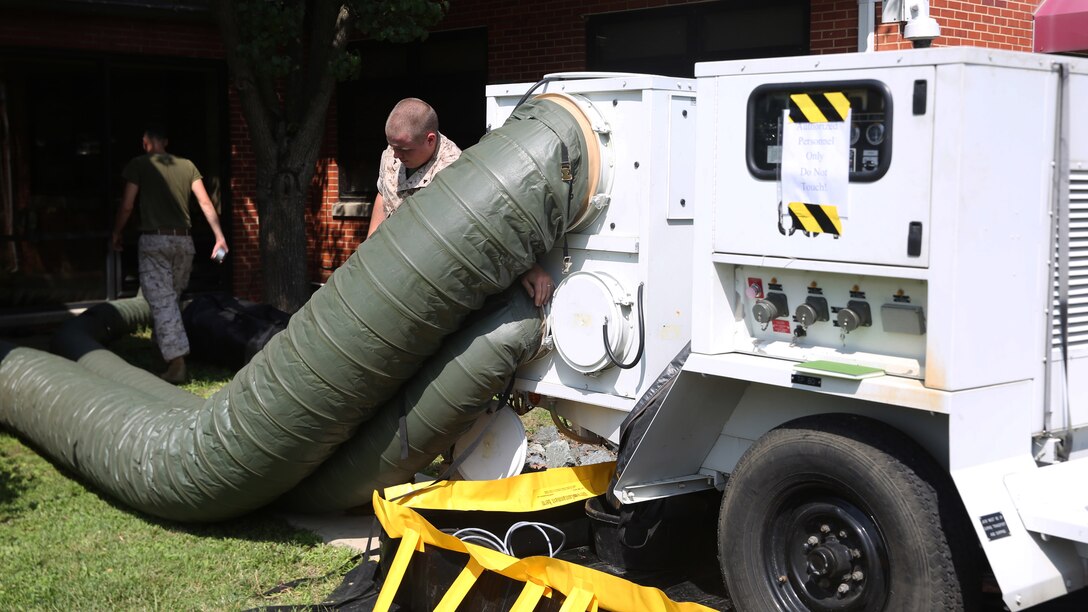 Marines with engineer platoon, Chemical Biological Incident Response Force set up a mobile air-conditioning unit at the local chow hall aboard Naval Support Facility Indian Head, Maryland, July 22, 2016. Providing air-conditioning to the chow hall gave the Marines hands-on training that further sharpens their skills needed to conduct expeditionary operations. 