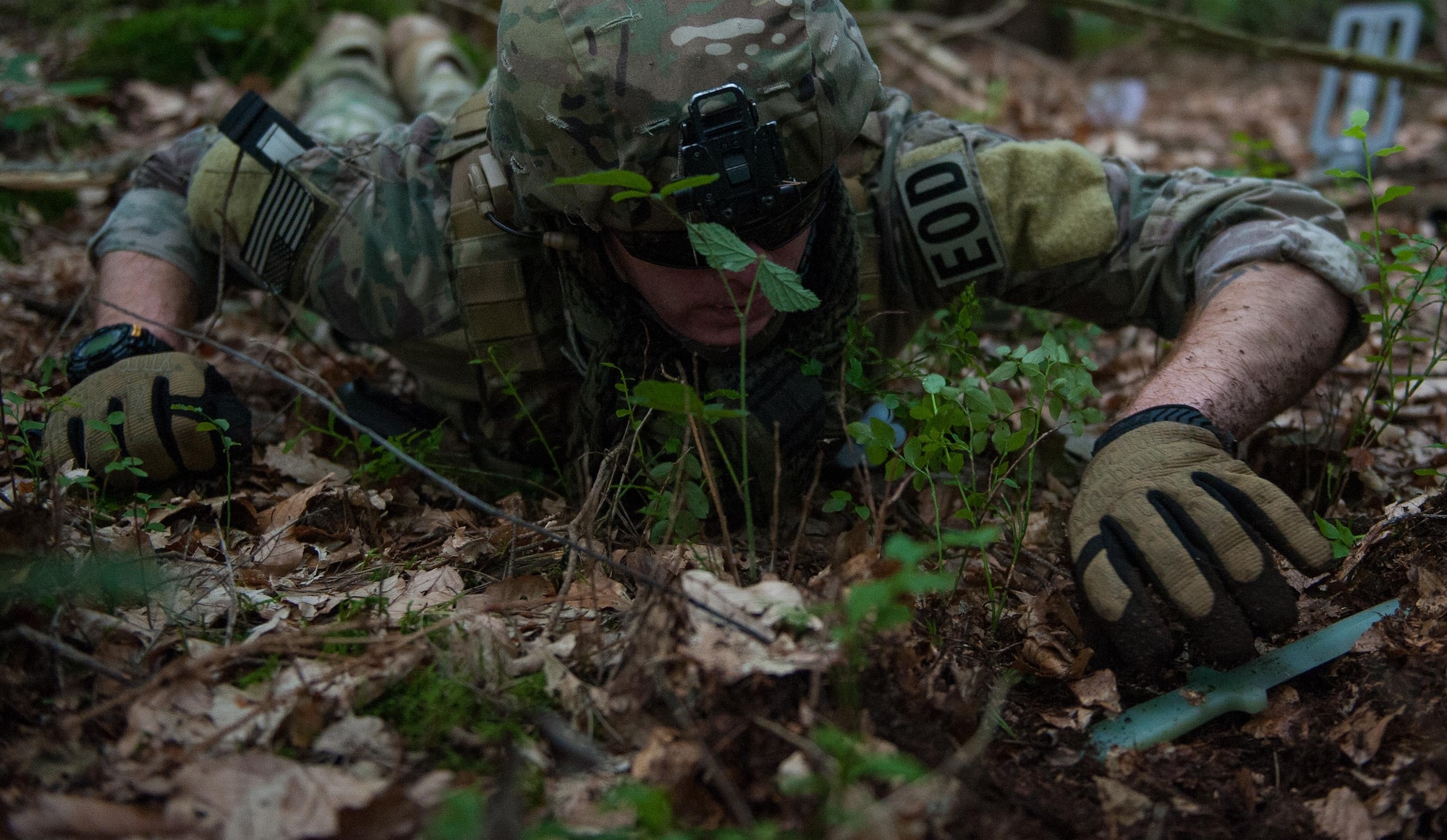Staff Sgt. Andrew Trelly, 786th Civil Engineering Squadron explosive ordnance disposal technician, digs around possible ordnance during a field-training exercise July 26, 2016, at Ramstein Air Base, Germany. The FTX included exercises in areas such as dismount-improvised explosive device training, nuclear weapons training and a joint-nuclear weapons response operation. (U.S. Air force photo/Airman 1st Class Lane T. Plummer)