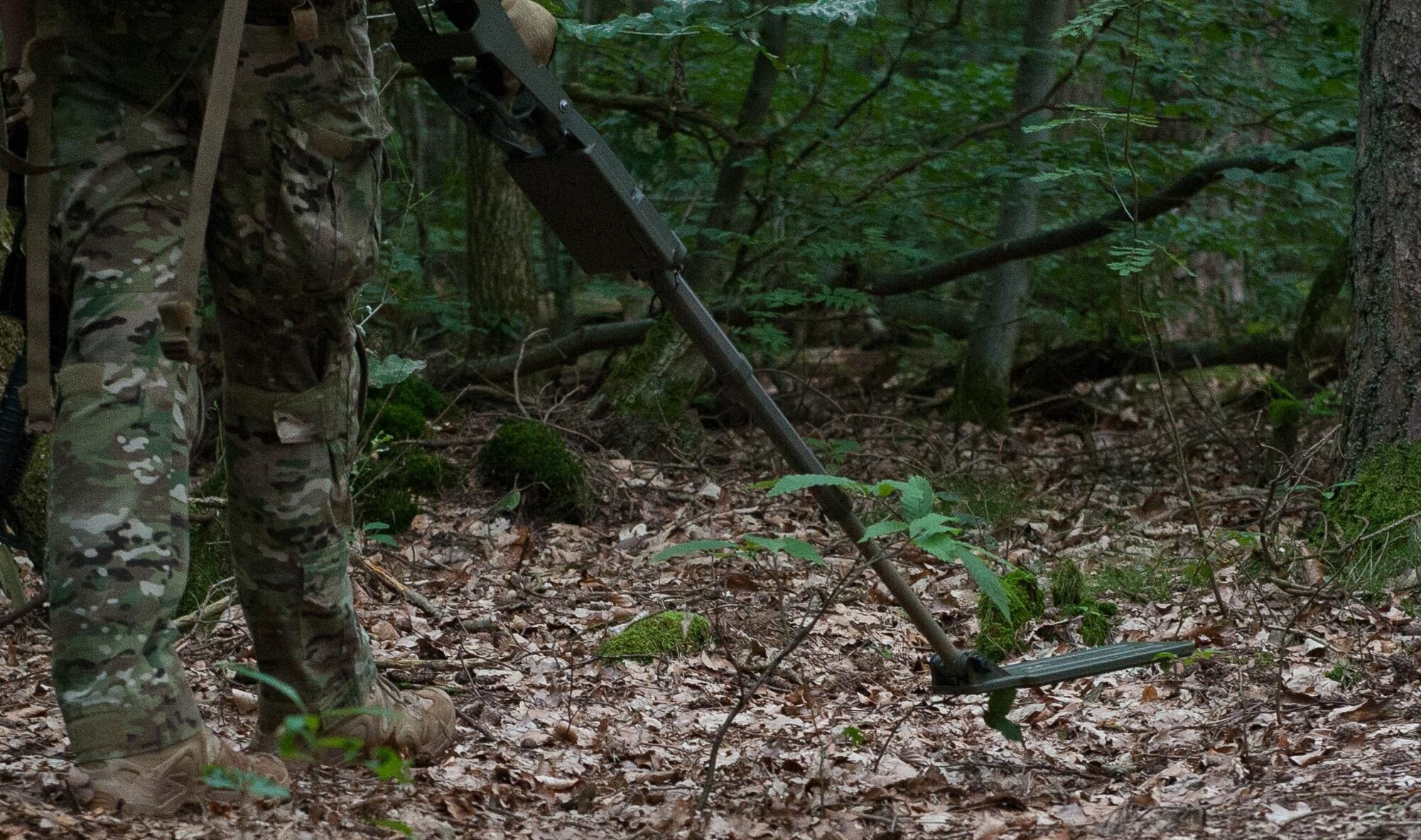 An Airmen from the 786th Civil Engineering Squadron explosive ordnance disposal flight searches for metal during a dismount-improvised explosive devise exercise July 26, 2016, at Ramstein Air Base, Germany. The training is part of a week-long event where EOD Airmen stay up to date on their job and maintain mission readiness. (U.S. Air force photo/Airman 1st Class Lane T. Plummer)