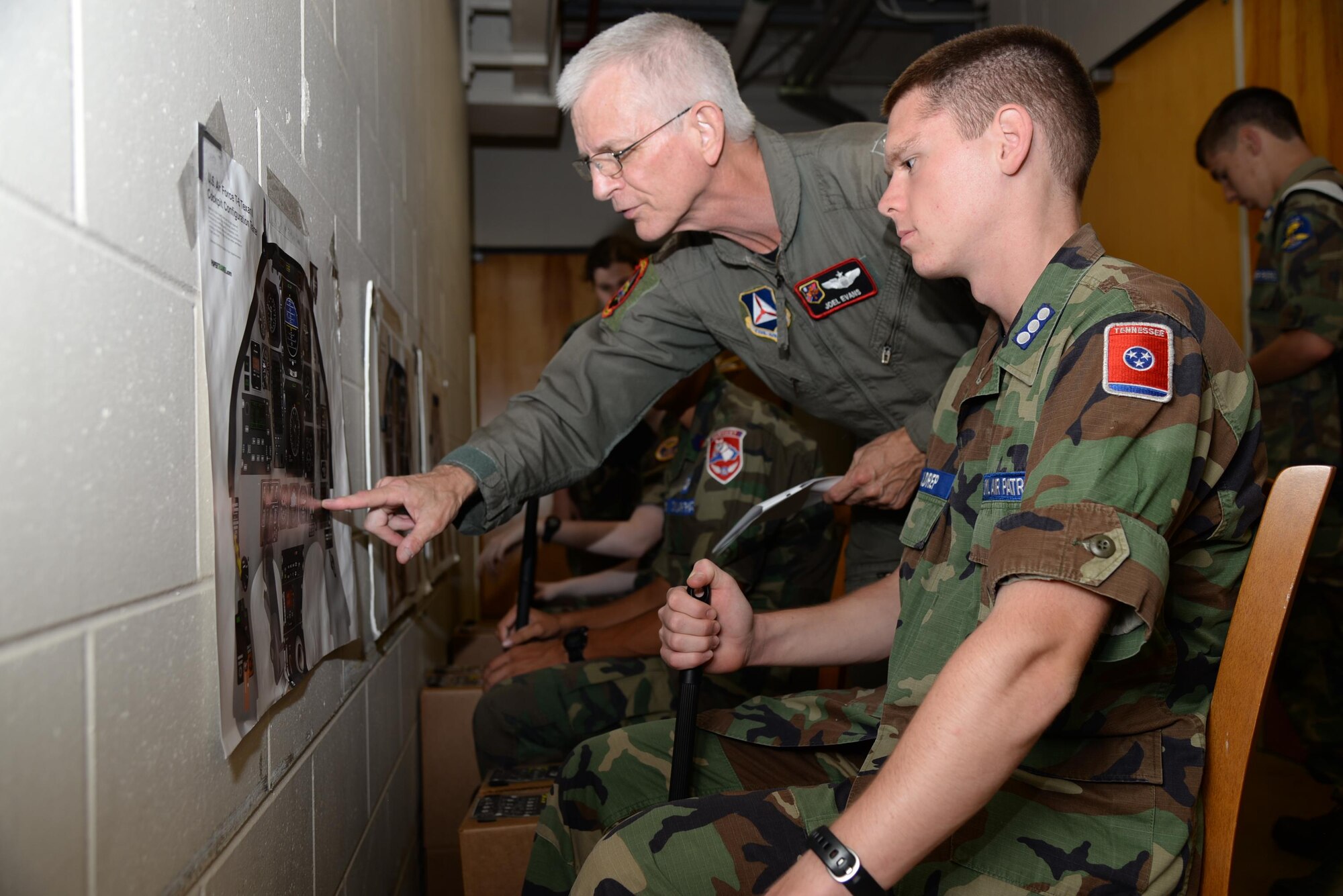 Civil Air Patrol cadets are instructed on how to chair fly July 26 on Columbus Air Force Base, Mississippi. The Specialized Undergraduate Pilot Training Familiarization Course is held at Columbus AFB every year to expose cadets to Air Force life and the SUPT environment. (U.S. Air Force photo/Airman 1st Class John Day)