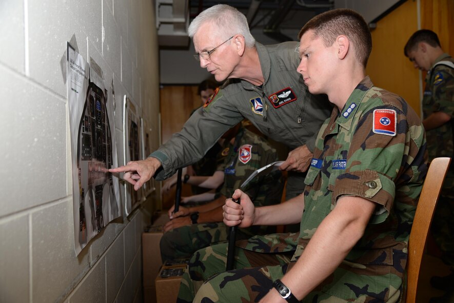 Civil Air Patrol cadets are instructed on how to chair fly July 26 on Columbus Air Force Base, Mississippi. The Specialized Undergraduate Pilot Training Familiarization Course is held at Columbus AFB every year to expose cadets to Air Force life and the SUPT environment. (U.S. Air Force photo/Airman 1st Class John Day)