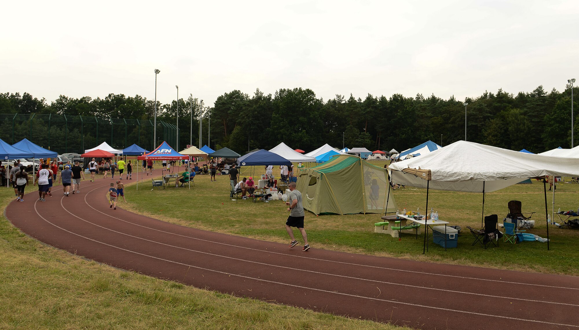 Participants jog laps at the 10th annual Viking Challenge July 22, 2016, at Pulaski Barracks, Germany. Military members and their families ran, walked or donated to the 24-hour marathon to raise funds for the community. (U.S. Air Force photo/Airman 1st Class Savannah L. Waters)