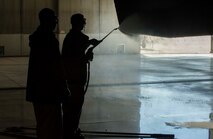 Airmen from the 5th Aircraft Maintenance Squadron wash the wing of a B-52H Stratofortress during a BUFF wash at Minot Air Force Base, N.D., July 25, 2016. Each aircraft receives a wash at least every 120 days. (U.S. Air Force photo/Senior Airman Apryl Hall)