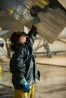 An Airman from the 5th Aircraft Maintenance Squadron washes a B-52H Stratofortress at Minot Air Force Base, N.D., July 25, 2016. Grease and contaminants that cause corrosion are removed from the aircraft during the wash. (U.S. Air Force photo/Senior Airman Apryl Hall)