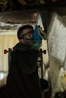 An Airman from the 5th Aircraft Maintenance Squadron scrubs a B-52H Stratofortress during a BUFF wash at Minot Air Force Base, N.D., July 25, 2016. During the wash, grease and contaminants that cause corrosion are removed from the aircraft. (U.S. Air Force photo/Senior Airman Apryl Hall)