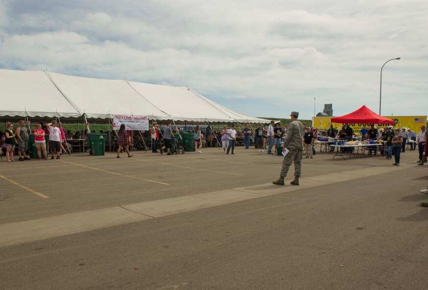 Col. Matthew Brooks, 5th Bomb Wing commander, speaks during Military Appreciation Day at the North Dakota State Fair in Minot, N.D., July 26, 2016. Brooks thanked the sponsors of the event for their unwavering support of the military. (U.S. Air Force photo/Senior Airman Apryl Hall)