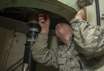 Airman 1st Class Joseph McHatton, 91st Missile Maintenance Squadron electromechanical technician, works on the secondary door combination lock at Minot Air Force Base, N.D., July 27, 2016. Making sure the technicians understand how the locks operate and effect other components in the secondary door ensures the security works smoothly to keep the launch facilities secure. (U.S. Air Force photo/Airman 1st Class Christian Sullivan)